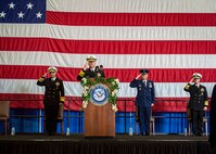 Adm. Christopher W. Grady, commander, U.S. Fleet Forces Command (USFFC), center, Adm. Charles Richard, commander, U.S. Strategic Command, left, Air Force Gen. Glen VanHerck, commander, U.S. Northern Command, and Adm. Daryl Caudle give a collective salute during the USFFC change of command ceremony aboard USS George H. W. Bush (CVN 77), Dec. 7, 2021.