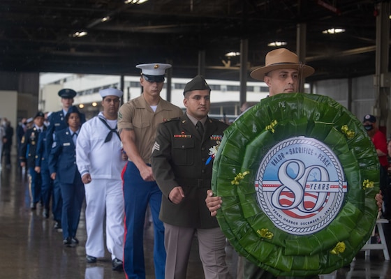 PEARL HARBOR, Hawaii (Dec. 7, 2021) A National Park Service ranger, along with service members from each military branch, participate in a wreath presentation ceremony during the 80th Anniversary Pearl Harbor Remembrance. Dec. 7, 2021, marks the 80th anniversary of the attacks on Pearl Harbor and Oahu. The U.S. military, State of Hawaii and National Park Service are hosting a series of remembrance events throughout the week to honor the courage and sacrifices of those who served throughout the Pacific Theater. Today, the U.S.-Japan Alliance is a cornerstone of peace and security in a free and open Indo-Pacific region. (U.S. Navy photo by Mass Communication Specialist 2nd Class Nick Bauer)