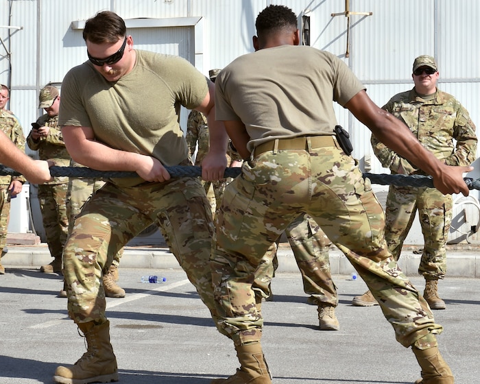 Members of the U.S. Air Force's 380th Air Expeditionary Wing compete in a truck-pulling competition here on Nov. 11, 2021 in commemoration of Veterans Day. The event, "Pull Together for Veterans," brought the U.S. Army and U.S. Air Force together in a friendly competition to raise awareness on veterans' sacrifices.