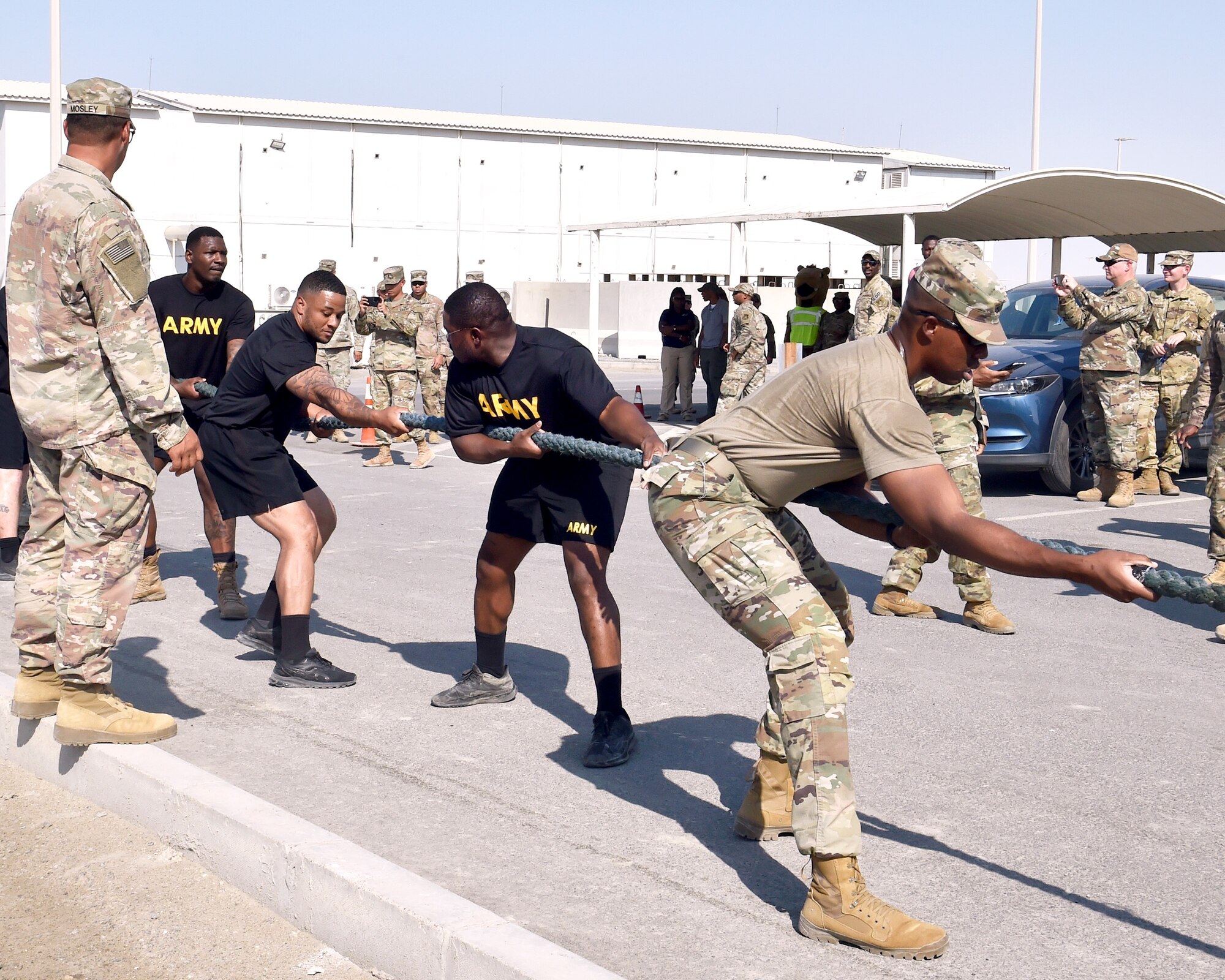 Members of the 1st Battalion, 44th Air Defense Artillery Regiment, Fort Hood, Texas, compete in a truck-pulling competition here on Nov. 11, 2021 in commemoration of Veterans Day. The event, "Pull Together for Veterans," brought the U.S. Army and U.S. Air Force together in a friendly competition to raise awareness on veterans' sacrifices.