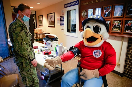 Norfolk Naval Shipyard’s mascot, Yardbird Sam, has his vitals taken at a recent blood drive.