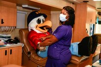 Norfolk Naval Shipyard’s mascot, Yardbird Sam, participates in a recent blood drive at the shipyard.