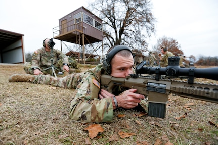 Shooters take the line to zero their rifles at the Fort Chaffee Joint Maneuver Training Center, Barling, Arkansas, Dec. 4, 2021. These shooters are part of the 33 sniper teams gathered at the 51st Winston P. Wilson and 31st Armed Forces Skill at Arms Meeting Sniper Rifle Matches hosted by the National Guard Marksmanship Training Center at Fort Chaffee Dec. 4-9.