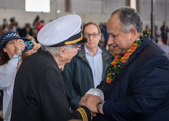 PEARL HARBOR, Hawaii (Dec. 7, 2021) Secretary of the Navy (SECNAV) Carlos Del Toro interacts with a World War II veteran during the 80th Anniversary Pearl Harbor Remembrance. Dec. 7, 2021, marks the 80th anniversary of the attacks on Pearl Harbor and Oahu. The U.S. military, State of Hawaii and National Park Service are hosting a series of remembrance events throughout the week to honor the courage and sacrifices of those who served throughout the Pacific Theater. Today, the U.S.-Japan Alliance is a cornerstone of peace and security in a free and open Indo-Pacific region. (U.S. Navy photo by Mass Communication Specialist 2nd Class Nick Bauer)