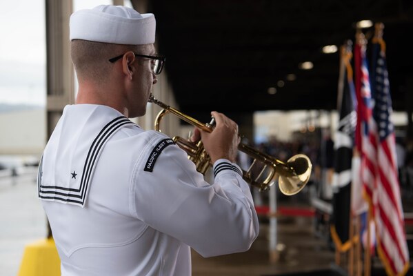 PEARL HARBOR, Hawaii (Dec. 7, 2021) Muscian Seaman Cory Johnson, U.S. Pacific Fleet Band, plays taps at the 80th Anniversary Pearl Harbor Remembrance. Dec. 7, 2021, marks the 80th anniversary of the attacks on Pearl Harbor and Oahu. The U.S. military, State of Hawaii and National Park Service are hosting a series of remembrance events throughout the week to honor the courage and sacrifices of those who served throughout the Pacific Theater. Today, the U.S.-Japan Alliance is a cornerstone of peace and security in a free and open Indo-Pacific region. (U.S. Navy photo by Mass Communication Specialist 1st Class Jessica Gray)