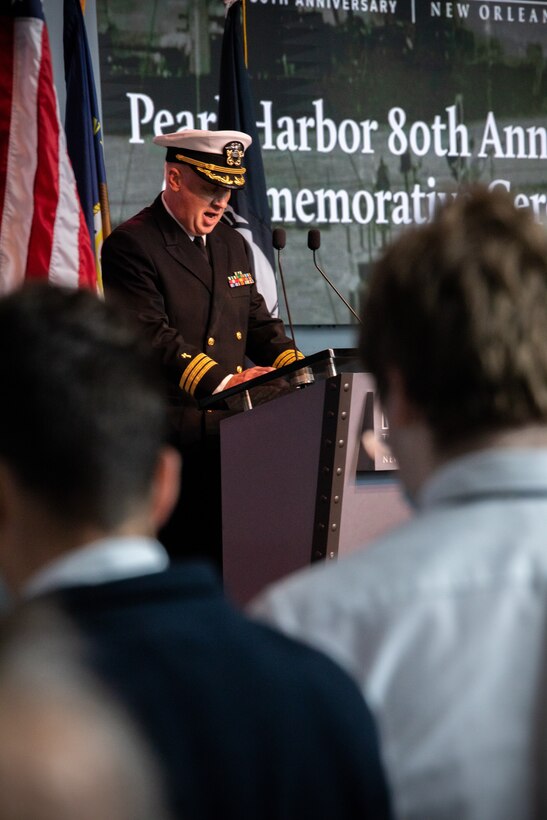 Cmdr. Erik Young, Chaplain, Marine Forces Reserve, leads a prayer during a commemorative ceremony for the 80th anniversary of the attack on Pearl Harbor at the National World War II Museum in New Orleans on Dec. 7, 2021. Civilians, veterans and service members came together to honor those who perished during the attack on Dec. 7, 1941 and to show appreciation for service members who would go on to fight during WWII. (U.S. Marine Corps photo by Cpl. Jonathan L. Gonzalez)