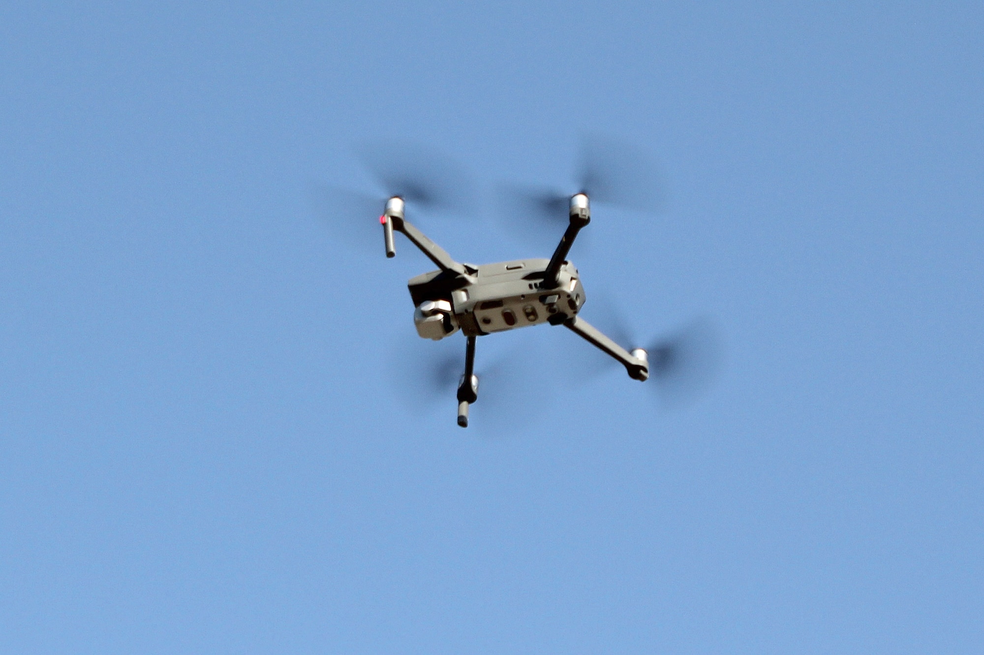 An unmanned aerial system, operated by the 380th Expeditionary Security Forces Squadron, flies over Al Dhafra Air Base, United Arab Emirates during an exercise at the base, Dec. 3, 2021. The 380th Expeditionary Security Forces Squadron at the base has responsibility for countering potential UAS threats.