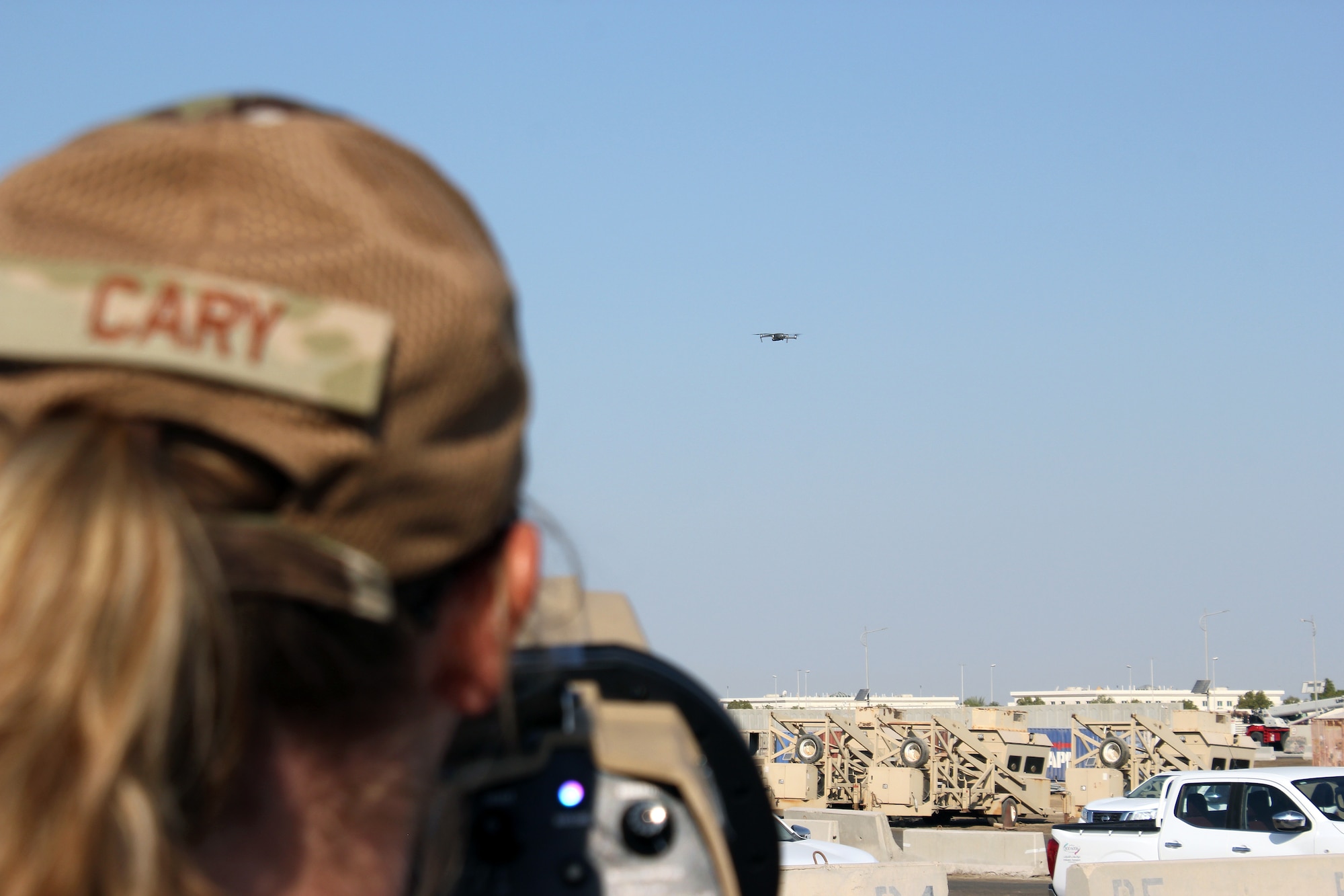 Tech. Sgt. Christina Cary uses a dronebuster to interrupt the signal to an Unmanned Aerial System, during an exercise at Al Dhafra Air Base, United Arab Emirates, Dec. 3, 2021. The 380th Expeditionary Security Forces Squadron at the base has responsibility for countering potential UAS threats.