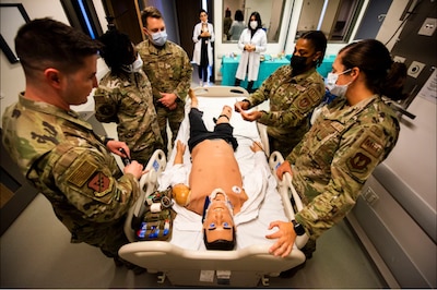 Airmen assigned to the 39th Operational Medical Readiness Squadron discuss various medical treatments at Acıbadem University in Istanbul, Turkey, Oct. 28, 2021. Airmen from the 39th OMRS visited Acıbadem’s Center of Advanced Simulation and Education to train in a more realistic environment, with state-of-the-art technology that provides real-time feedback to the medical team. The team, which consisted of a clinical nurse and two enlisted medical technicians, performed a spectrum of training scenarios, ranging from clinical patient care to tactical combat casualty care. They also capitalized on the opportunity to use the facility’s virtual reality capabilities to perform basic life-saving skills. (U.S. Air Force photo by Staff Sgt. Jacob Derry)