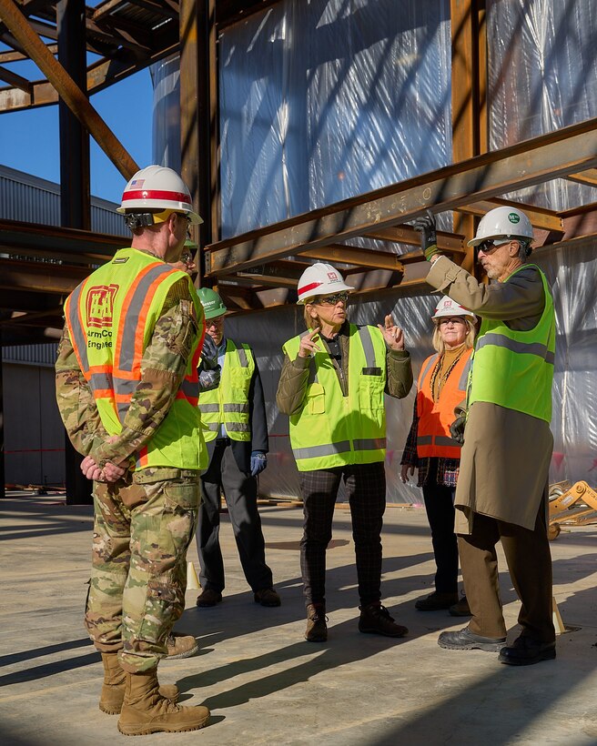 U.S. Army Corps of Engineers Director of Military Programs Dr. Christine Altendorf tours the Intelligence Production Complex construction site during a visit of Louisville District projects at Wright-Patterson Air Force Base, December 3, 2021. Altendorf discussed details about the $156 million facility with Messer Construction personnel and U.S. Army Col. Eric Crispino, Louisville District, district commander. The five-story complex broke ground November 5, 2020 and is scheduled for occupancy in 2025. (U.S. Army Corps of Engineers photo by Charles Delano)