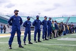 Coast Guard officer trainees lead the Norfolk State University (NSU) alumni and military veterans on the field to await the Presentation of Colors at the First Responders and Military Appreciation Day/Senior Day football game, Nov. 20, 2021. Photo courtesy of NSU staff.