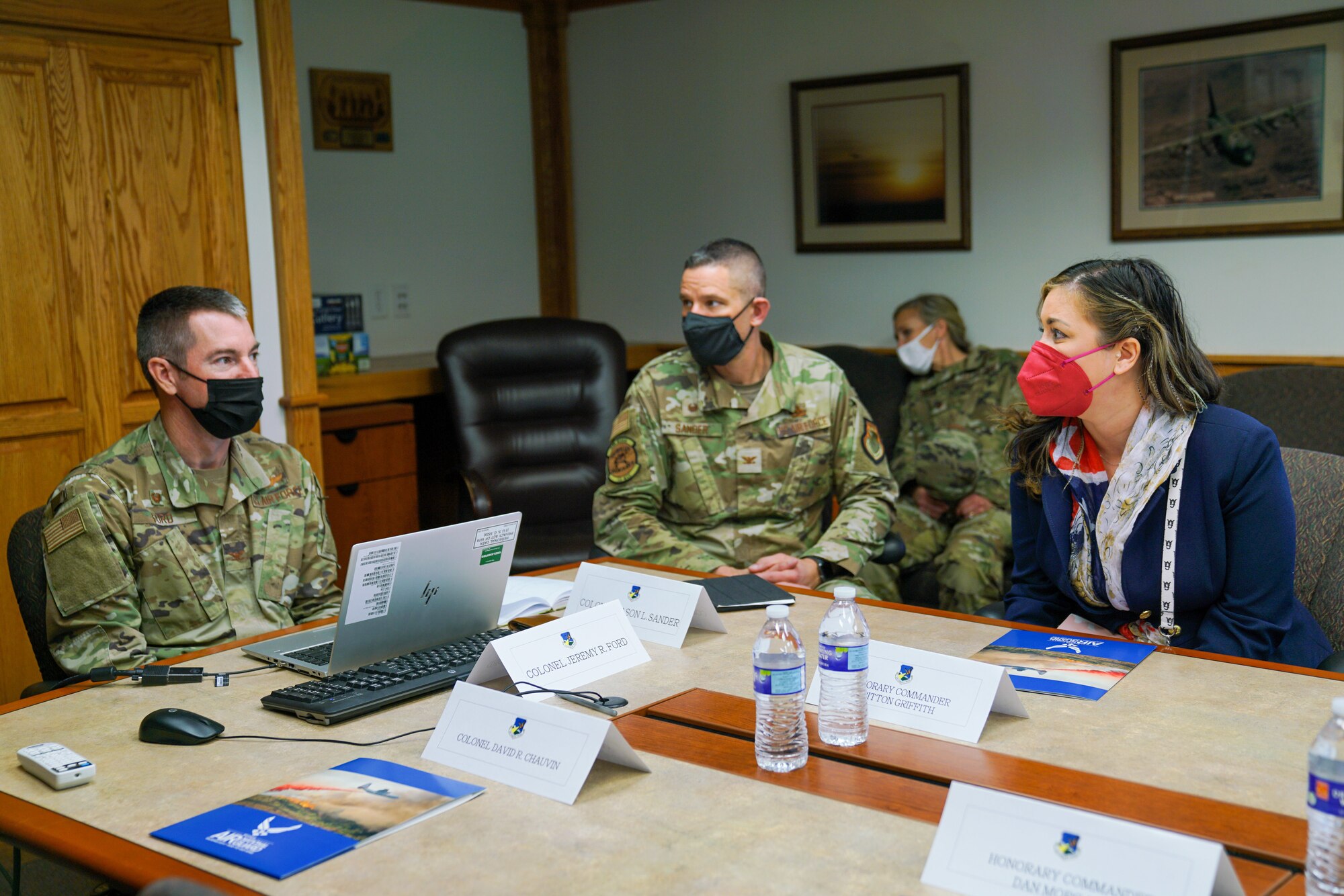 Col. Jeremy Ford, 152nd Airlift Wing commander (left), Col. Jason Sander, 152nd Maintenance Group commander (center) and Britton Griffith, honorary commander for the 152nd Aircraft Maintenance Squadron (right), Maj. Merridy Young, 152nd Aircraft Maintenance Squadron commander (back), meet at the first annual honorary commander meeting at the Nevada Air National Guard base here December 4, 2021. The Honorary Commander Program promotes relationships with civic leaders to increase community engagement (U.S. Air National Guard photo by Senior Airman Michelle Brooks).