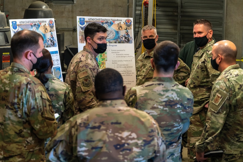 U.S. Air Force Maj. Gen. Michael G. Koscheski, Fifteenth Air Force commander, and Chief Master Sgt. Sonia T. Lee, Fifteenth AF command chief, receive a briefing from members of the 633d Civil Engineer Squadron at Joint Base Langley-Eustis, Virginia, Dec. 1, 2021.