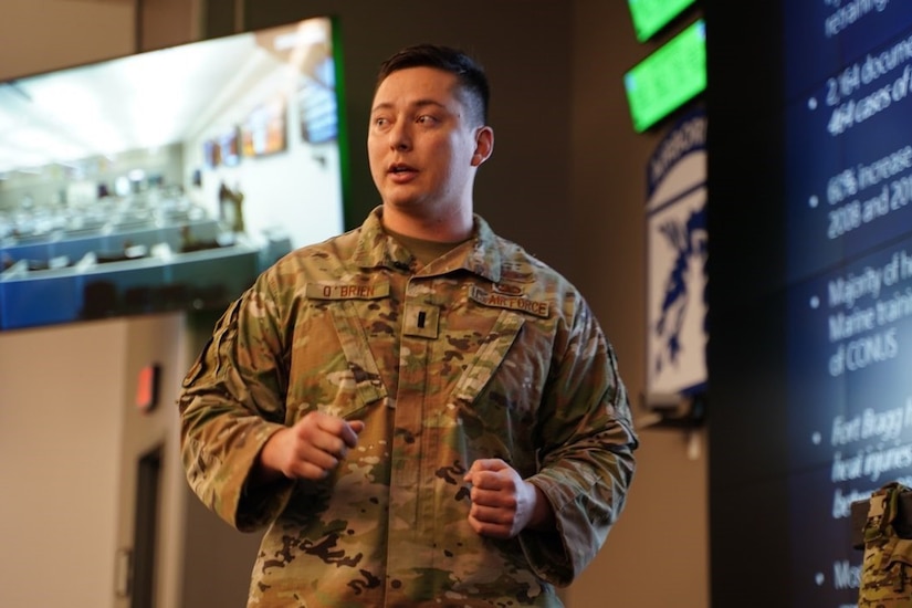 An Airman speaks during a presentation.