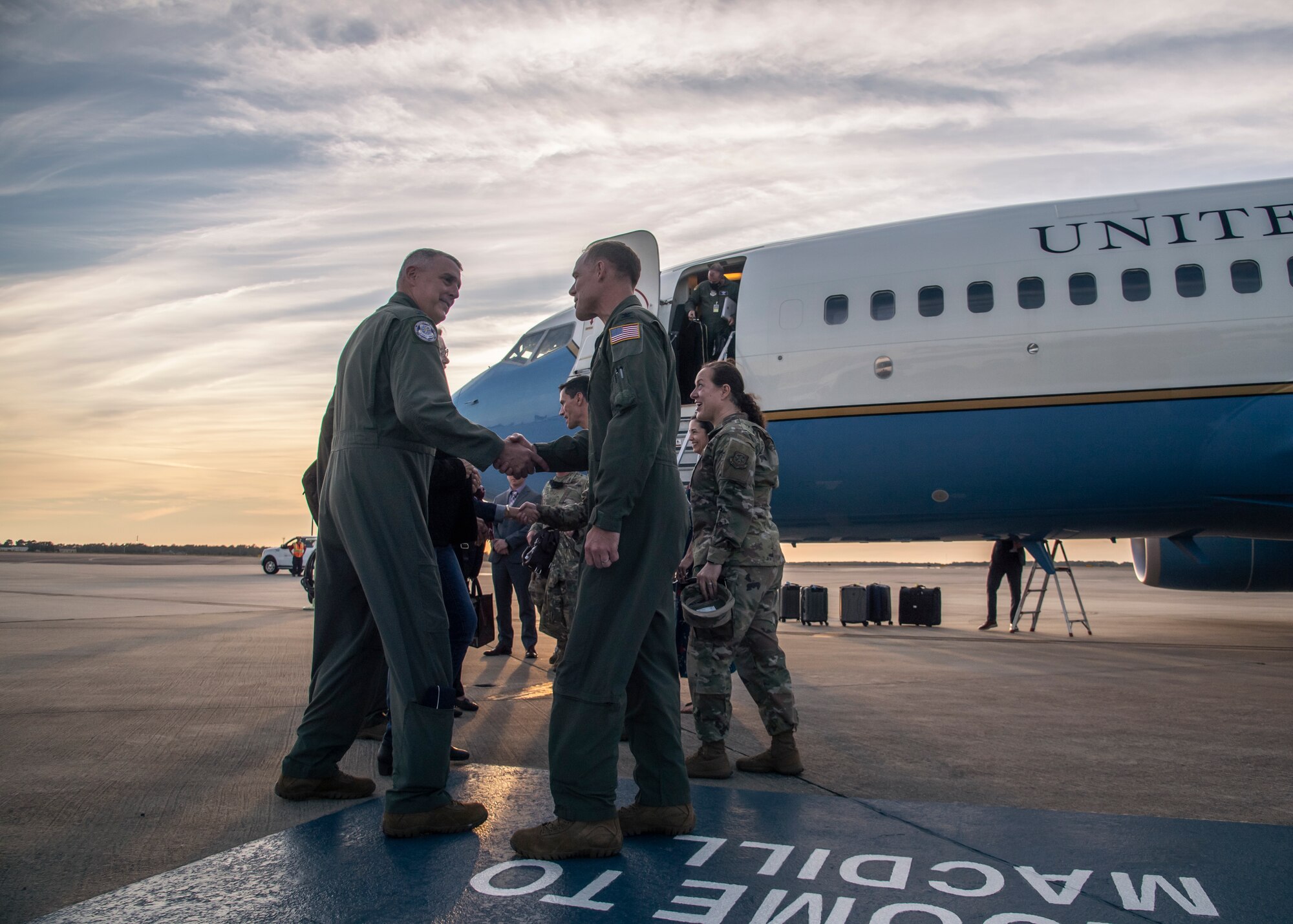U.S. Air Force Gen. Mike Minihan, commander of Air Mobility Command (AMC), shakes hands with U.S. Air Force Col. Benjamin Jonsson, 6th Air Refueling Wing (ARW) commander, at MacDill Air Force Base, Florida, Dec. 7, 2021.