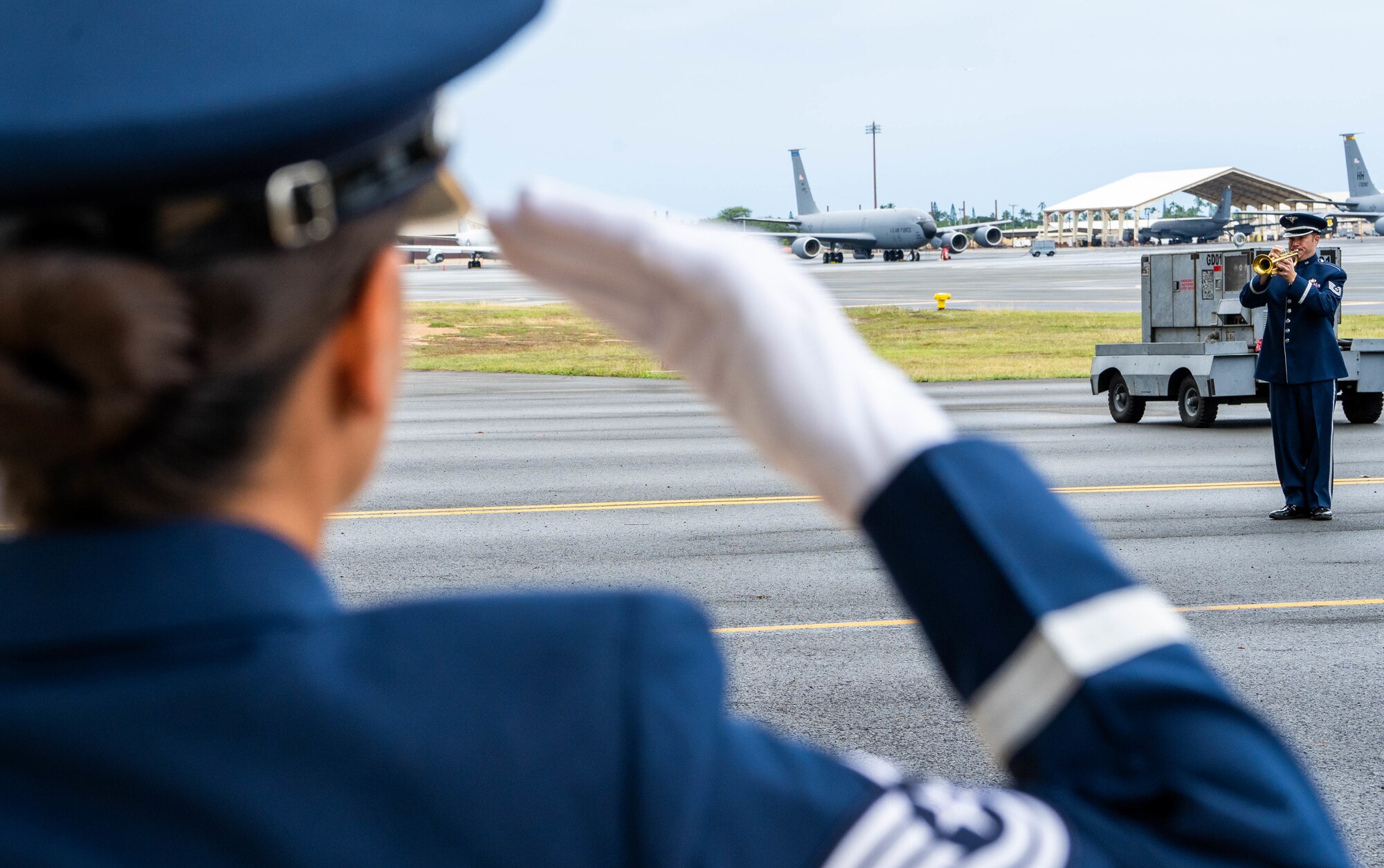 Tech Sgt. Nicholas Ciardelli, Band of the Pacific, regional band craftsman, trumpet, plays Taps during the December 7th Remembrance Ceremony at Joint Base Pearl Harbor-Hickam, Hawaii, Dec. 7, 2021. The 80th Remembrance Ceremony honors those who survived and those who paid the ultimate sacrifice during the attack on Hickam Field. (U.S Air Force photo by Airman 1st Class Makensie Cooper)