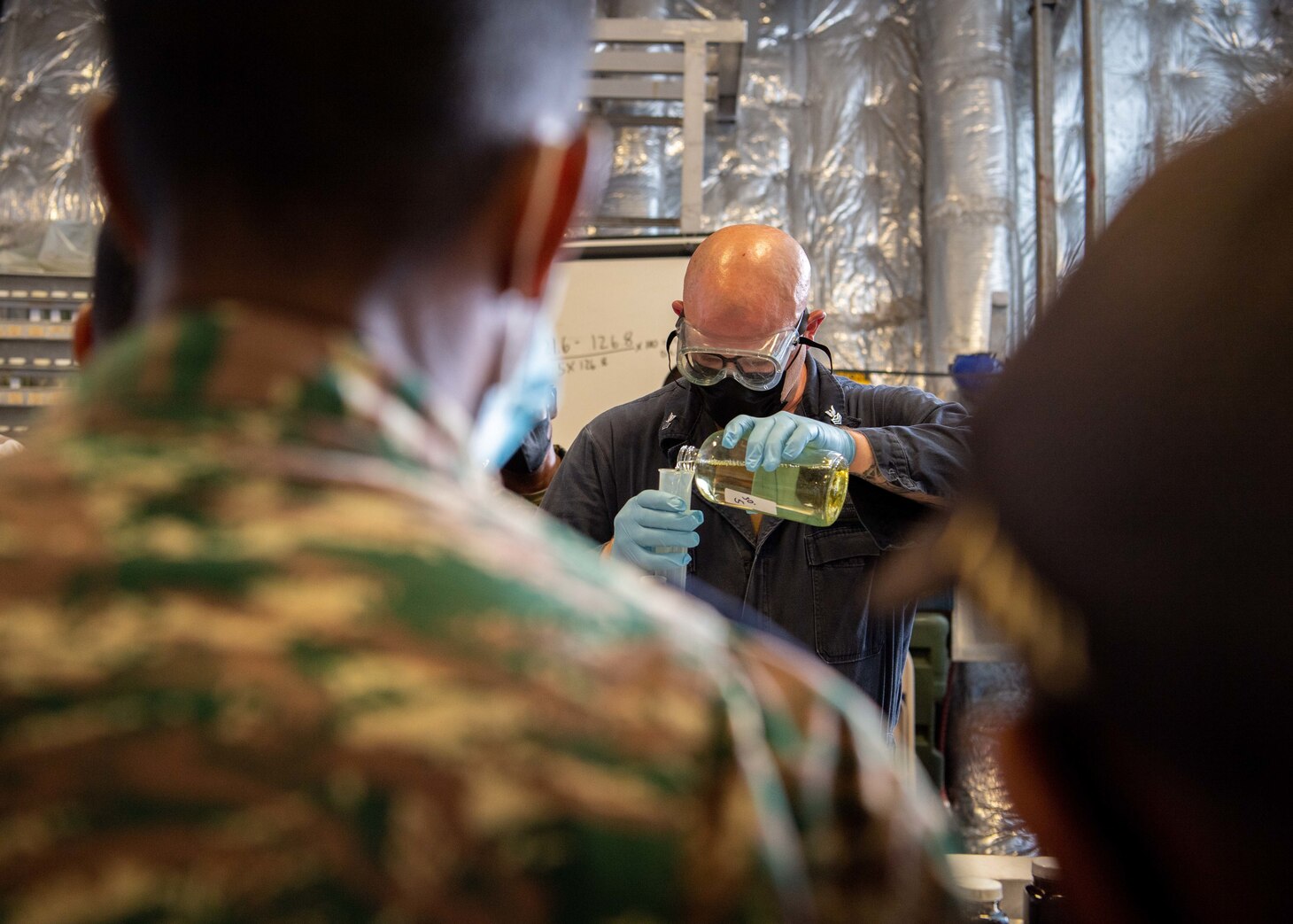 Engineman 1st Class Zane Vandorn, Camanche, Iowa, conducts oil lab training with members of the Timor-Leste Defense Force during Cooperation Afloat Readiness and Training (CARAT) from the mission bay aboard Independence-variant littoral combat ship USS Charleston (LCS 18). In its 27th year, the CARAT series is comprised of multinational exercises, designed to enhance U.S. and partnered navies’ abilities to operate together in response to traditional and non-traditional maritime security challenges in the Indo-Pacific region. Charleston, part of Destroyer Squadron (DESRON) 7, is on a rotational deployment in the U.S. 7th Fleet area of operation to enhance interoperability with partners and serve as a ready-response force in support of a free and open Indo-Pacific region.