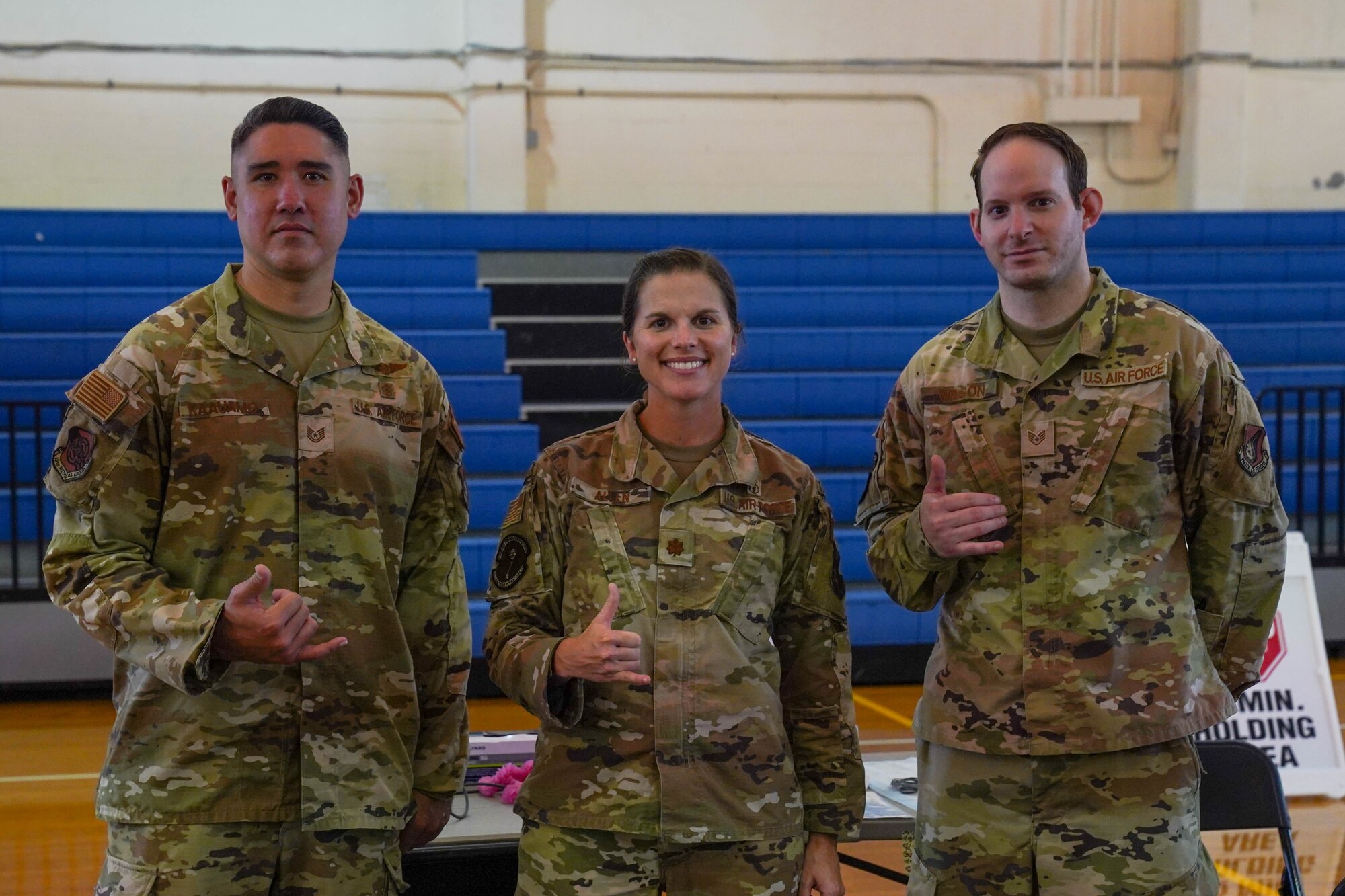 Tech. Sgt. Kalani Kaauamo, 15th Medical Group Ohana Clinic flight chief, Maj. Alison Allen, 15th Medical Group pediatrician, and Staff Sgt. Matthew Wilson, Immunizations Clinic NCOIC, are recognized for their efforts in coordinating the mass vaccination lines at Joint Base Pearl Harbor-Hickam, Hawaii, Nov. 30, 2021. In the course of a year, more than 2,300 vaccine lines were administered between the clinic, gym and tents vaccinating between 40 and 150 individuals a day. (U.S. Air Force photo by Airman 1st Class Makensie Cooper)