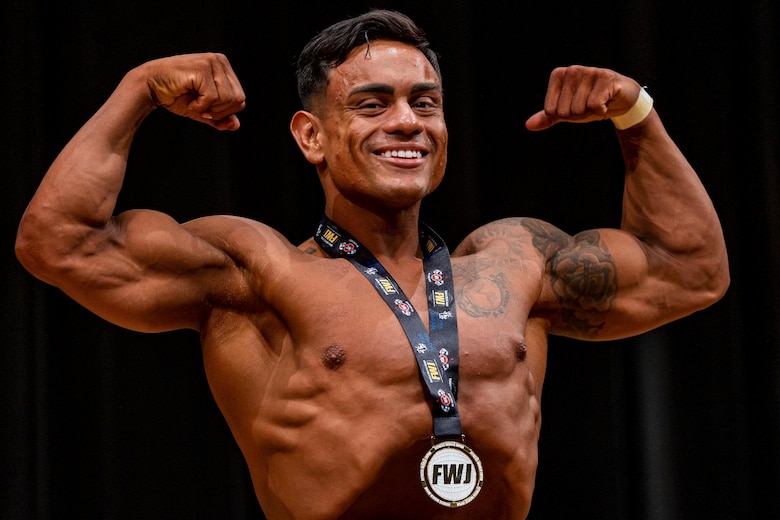 U.S. Marine Corps Staff Sgt. Jorge Gamboa, the mobility chief with Headquarters Battery, 12th Marine Regiment, 3rd Marine Division, poses after taking first place in the classic physique category at the Pan Pacific Okinawa Open bodybuilding competition in Kadena, Okinawa, Japan, July 3, 2021. Gamboa has served in the Marine Corps for seven years and at the age of 14 he started his bodybuilding journey with the ultimate goal of becoming an International Federation of Bodybuilding and Fitness Professional. (U.S. Marine Corps photo by Cpl. Brennan J. Beauton)