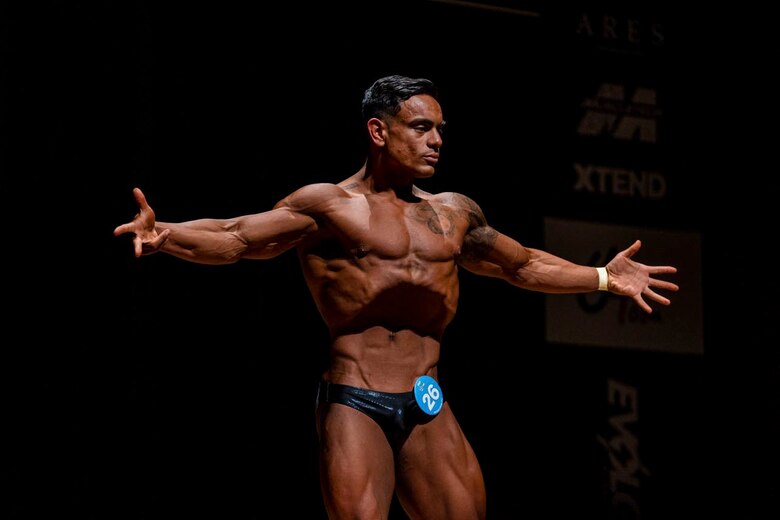 U.S. Marine Corps Staff Sgt. Jorge Gamboa, the mobility chief with Headquarters Battery, 12th Marine Regiment, 3rd Marine Division, poses during the Pan Pacific Okinawa Open bodybuilding competition in Kadena, Okinawa, Japan, July 3, 2021. Gamboa has served in the Marine Corps for seven years and at the age of 14 he started his bodybuilding journey with the ultimate goal of becoming an International Federation of Bodybuilding and Fitness Professional. (U.S. Marine Corps photo by Cpl. Brennan J. Beauton)