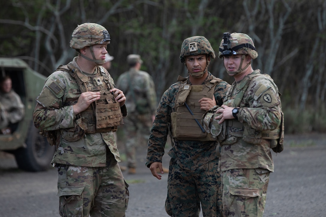 U.S. Navy Sailors with Bravo Surgical Company, 3d Medical Battalion, work alongside Army Soldiers with 2-14 Cavalry Squadron during Operation Big Wave, Marine Corps Training Area Bellows, Hawaii, Nov. 30, 2021. Operation Big Wave is a training exercise conducted by 3d Battalion, 3d Marines, in conjunction with Army 2-14 Cavalry Squadron, in order to produce readiness and promote joint-branch cooperation. (U.S. Marine Corps photo by Cpl. Brandon Aultman)