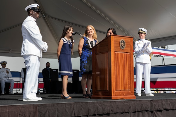 PEARL HARBOR, Hawaii (Dec. 8, 2021) Maggie Inouye, granddaughter of the ship's namesake, orders the crew to "man our ship and bring her to life" during the commissioning ceremony of USS Daniel Inouye (DDG 118). Homeported at Joint Base Pearl Harbor-Hickam, DDG 118 is the first U.S. Navy warship to honor the Honorable Daniel K. Inouye, a U.S. senator from Hawaii who served from 1962 until his death in 2012. During World War II, Inouye served in the U.S. Army’s 442nd Regimental Combat Team, one of the most decorated military units in U.S. history. For his combat heroism, which cost him his right arm, Inouye was awarded the Medal of Honor. (U.S. Navy photo by Mass Communication Specialist 1st Class Kelby Sanders)