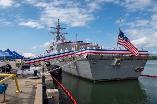 PEARL HARBOR, Hawaii (Dec. 8, 2021) The crew of the Navy's newest guided-missile destroyer, USS Daniel Inouye (DDG 118), brings the ship to life during its commissioning ceremony. Homeported at Joint Base Pearl Harbor-Hickam, DDG 118 is the first U.S. Navy warship to honor the Honorable Daniel K. Inouye, a U.S. senator from Hawaii who served from 1962 until his death in 2012. During World War II, Inouye served in the U.S. Army’s 442nd Regimental Combat Team, one of the most decorated military units in U.S. history. For his combat heroism, which cost him his right arm, Inouye was awarded the Medal of Honor. (U.S. Navy photo by Mass Communication Specialist the Navy's 2nd Class Nick Bauer)