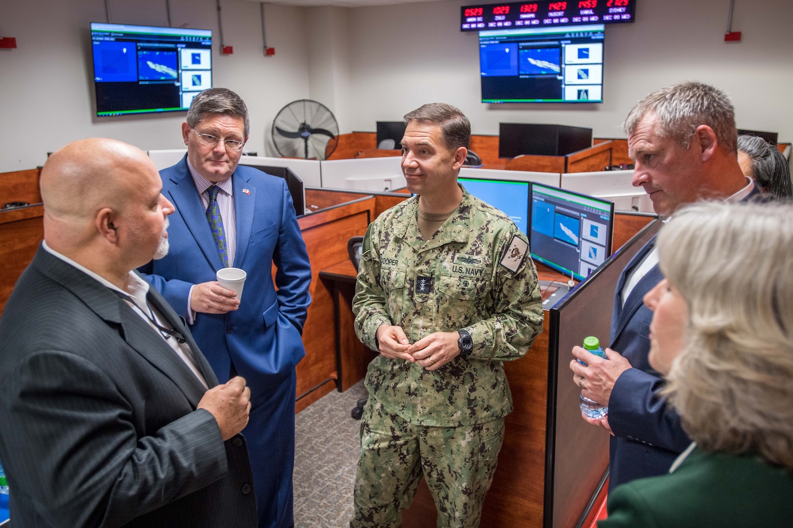 211208-N-OC333-2111 NAVAL SUPPORT ACTIVITY BAHRAIN (Dec. 8, 2021) From the left, Fred Paris, law enforcement co-director of Regional Narcotics Interagency Fusion Cell (RNIFC), Roddy Drummond, U.K. Ambassador to Bahrain, Vice Adm. Brad Cooper, commander of U.S. Naval Forces Central Command (NAVCENT), U.S. 5th Fleet and Combined Maritime Forces (CMF), William J. Warren Jr., Middle East regional director of the Drug Enforcement Agency and Maggie Nardi, charge d’affaires, U.S. Embassy to Bahrain, meet during a ribbon cutting ceremony for the opening of the new interagency counter narcotics facility at Naval Support Activity Bahrain, Dec. 8. The facility will be operated by the RNIFC, a joint Department of Defense and law enforcement team established seven years ago and comprised of personnel from NAVCENT, CMF, and law enforcement agency partners to support maritime and land drug interdiction operations.