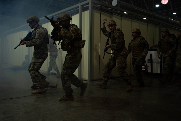 Airmen conduct a security patrol during TCCC exercise