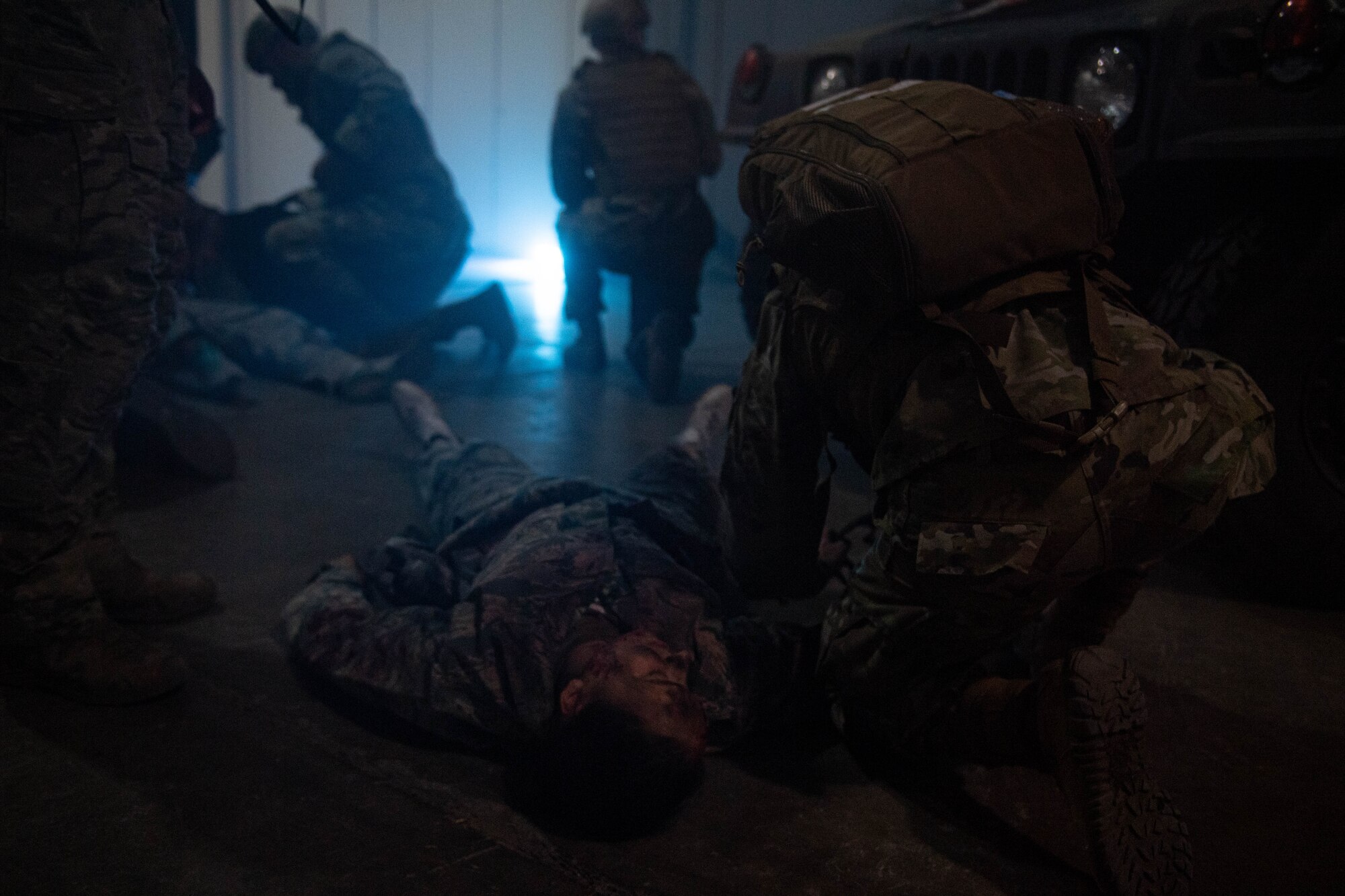 Airmen treats a simulated patient during an exercise