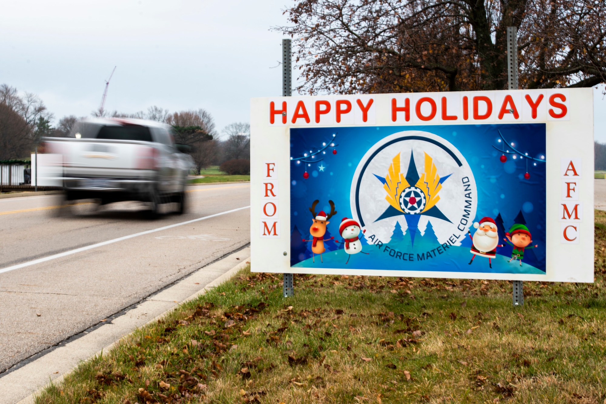 Giant Christmas cards designed by base organizations line Skeel Ave on Wright-Patterson Air Force Base, Ohio. The cards were an attempt to keep people socially connected during COVID-19. (U.S. Air Force photo by Wesley Farnsworth)