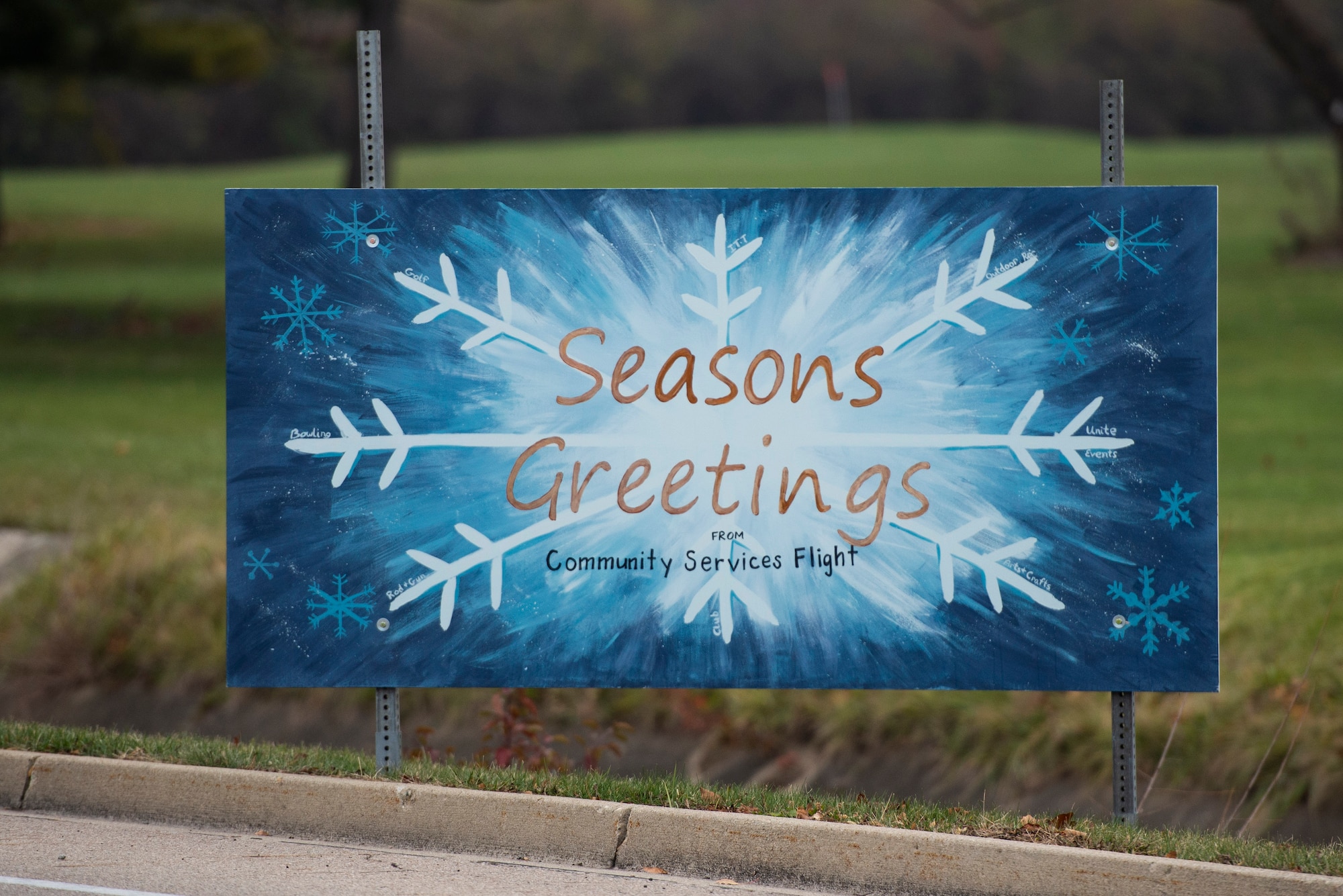 Giant Christmas cards designed by base organizations line Skeel Ave on Wright-Patterson Air Force Base, Ohio. The cards were an attempt to keep people socially connected during COVID-19. (U.S. Air Force photo by Wesley Farnsworth)
