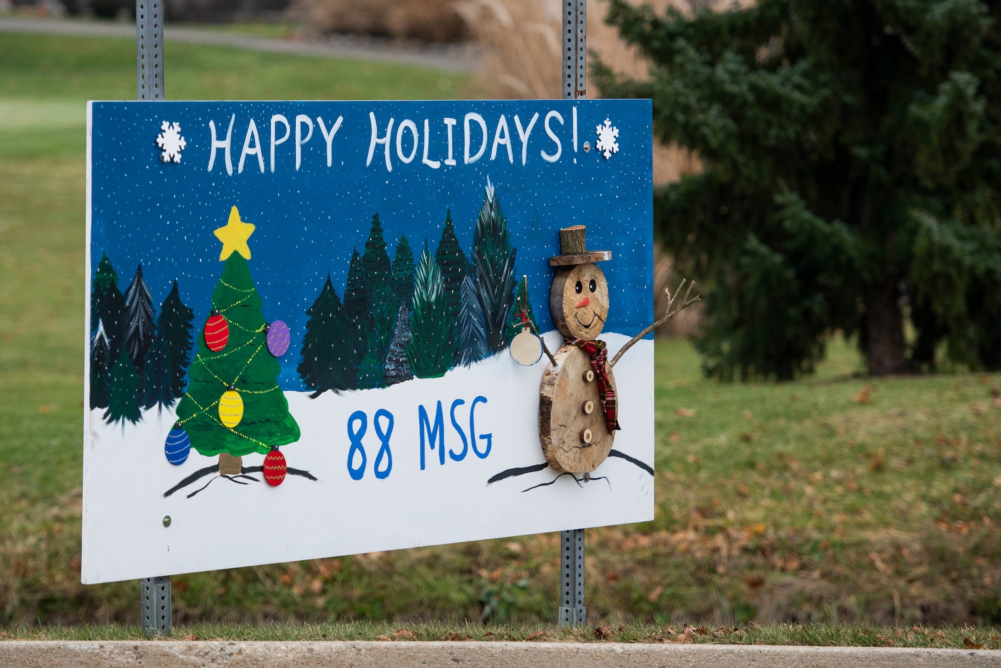 Giant Christmas cards designed by base organizations line Skeel Ave on Wright-Patterson Air Force Base, Ohio. The cards were an attempt to keep people socially connected during COVID-19. (U.S. Air Force photo by Wesley Farnsworth)