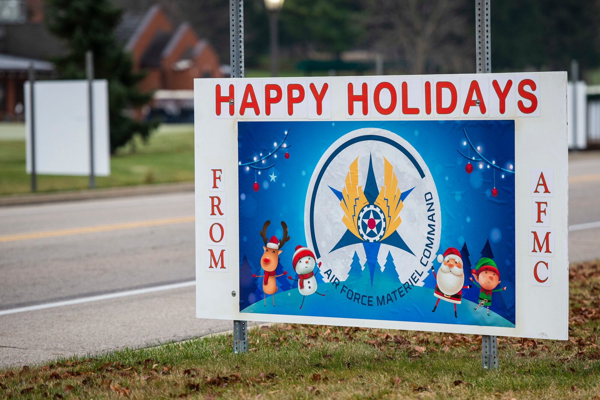 Giant Christmas cards designed by base organizations line Skeel Ave on Wright-Patterson Air Force Base, Ohio. The cards were an attempt to keep people socially connected during COVID-19. (U.S. Air Force photo by Wesley Farnsworth)