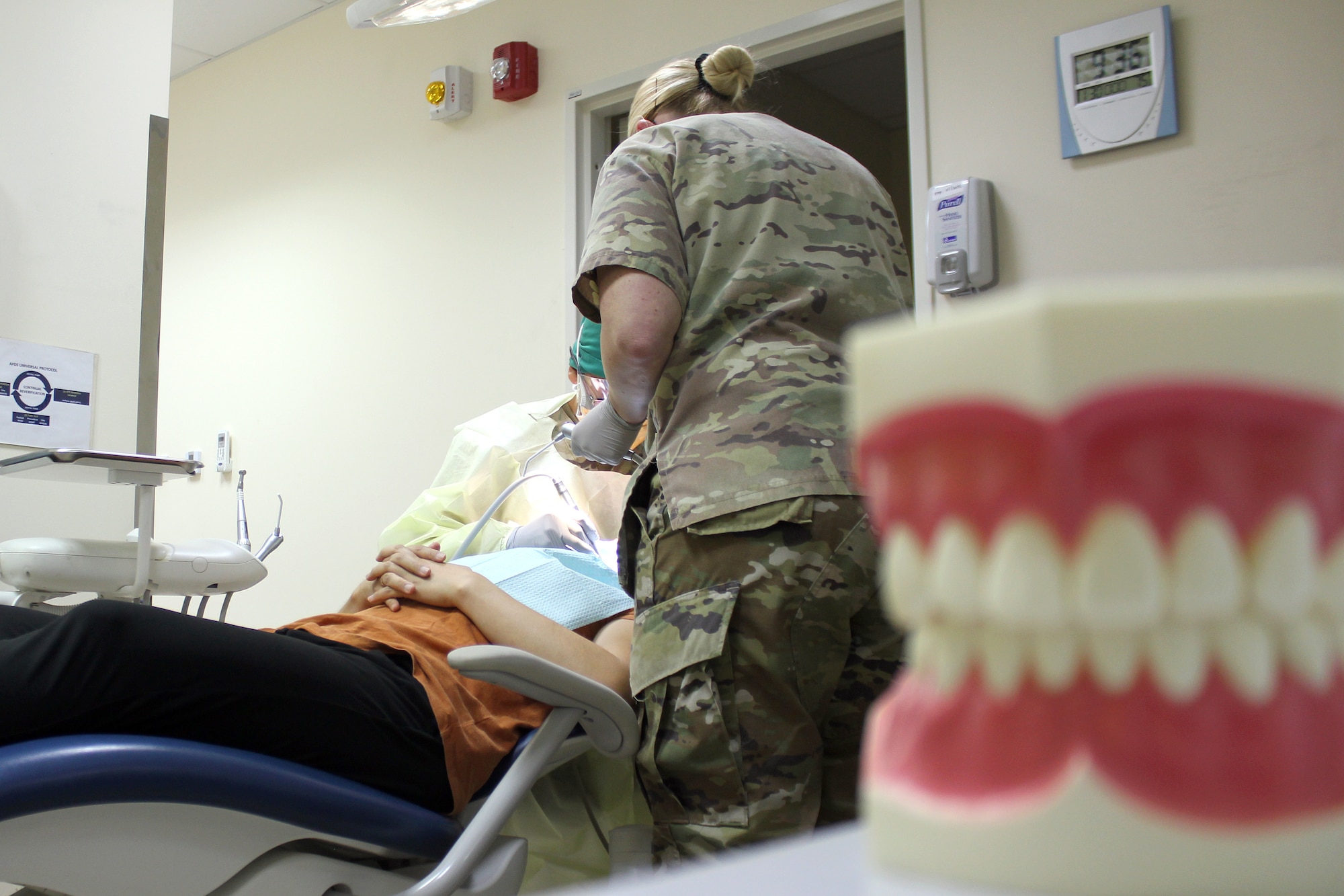 Tech. Sgt. Tiffani Lawter, a dental technician with the 380th Medical Group, prepares instruments for a dental procedure at the medical clinic at Al Dhafra Air Base, United Arab Emirates, Nov. 30, 2021. The dental office at the clinic provides emergency dental services to support the 380th Air Expeditionary Wing and other U.S. operations at the base. Lawter is forward deployed from the 131st Bomb Wing, Missouri Air National Guard.