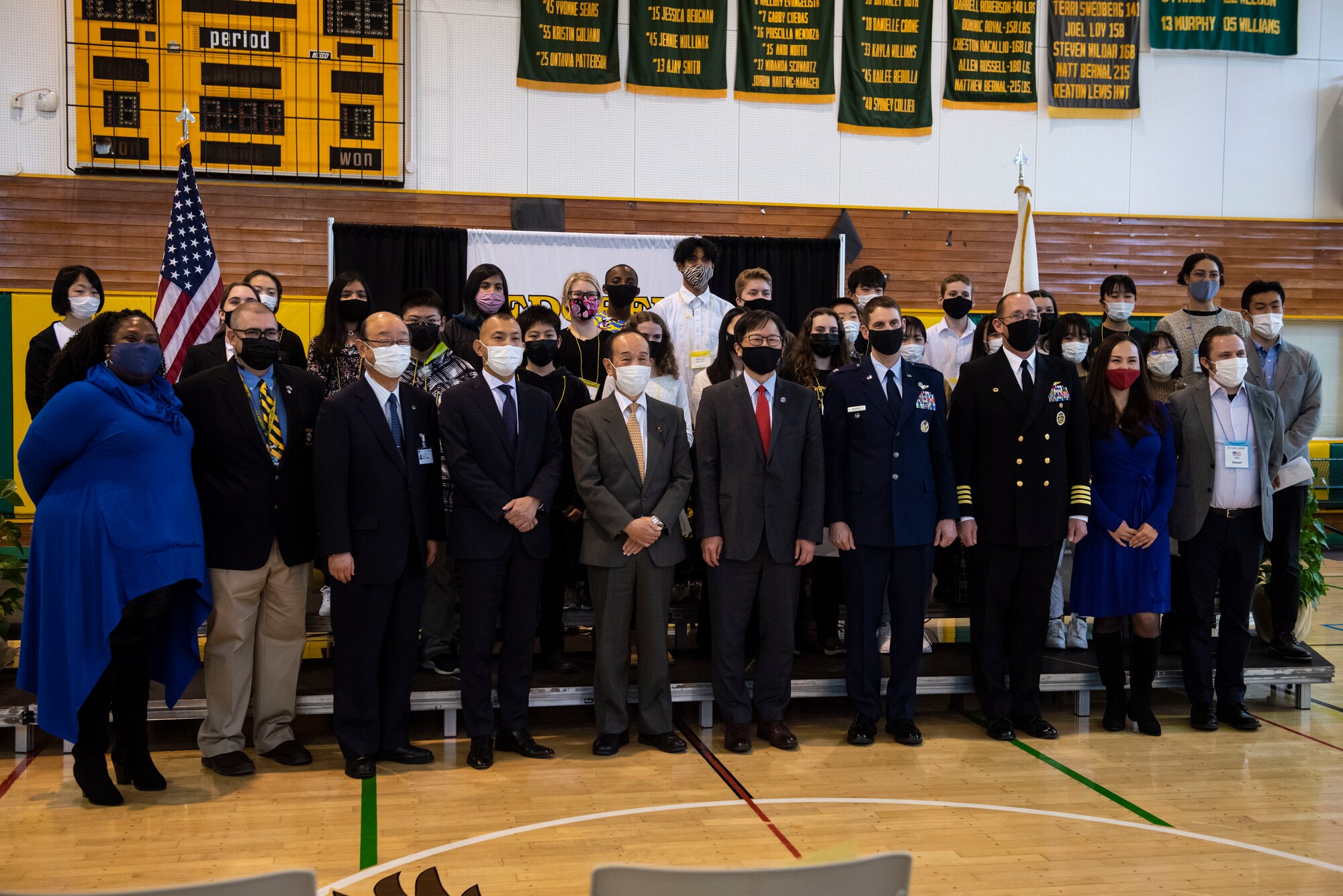 Military and government officials group together for a picture