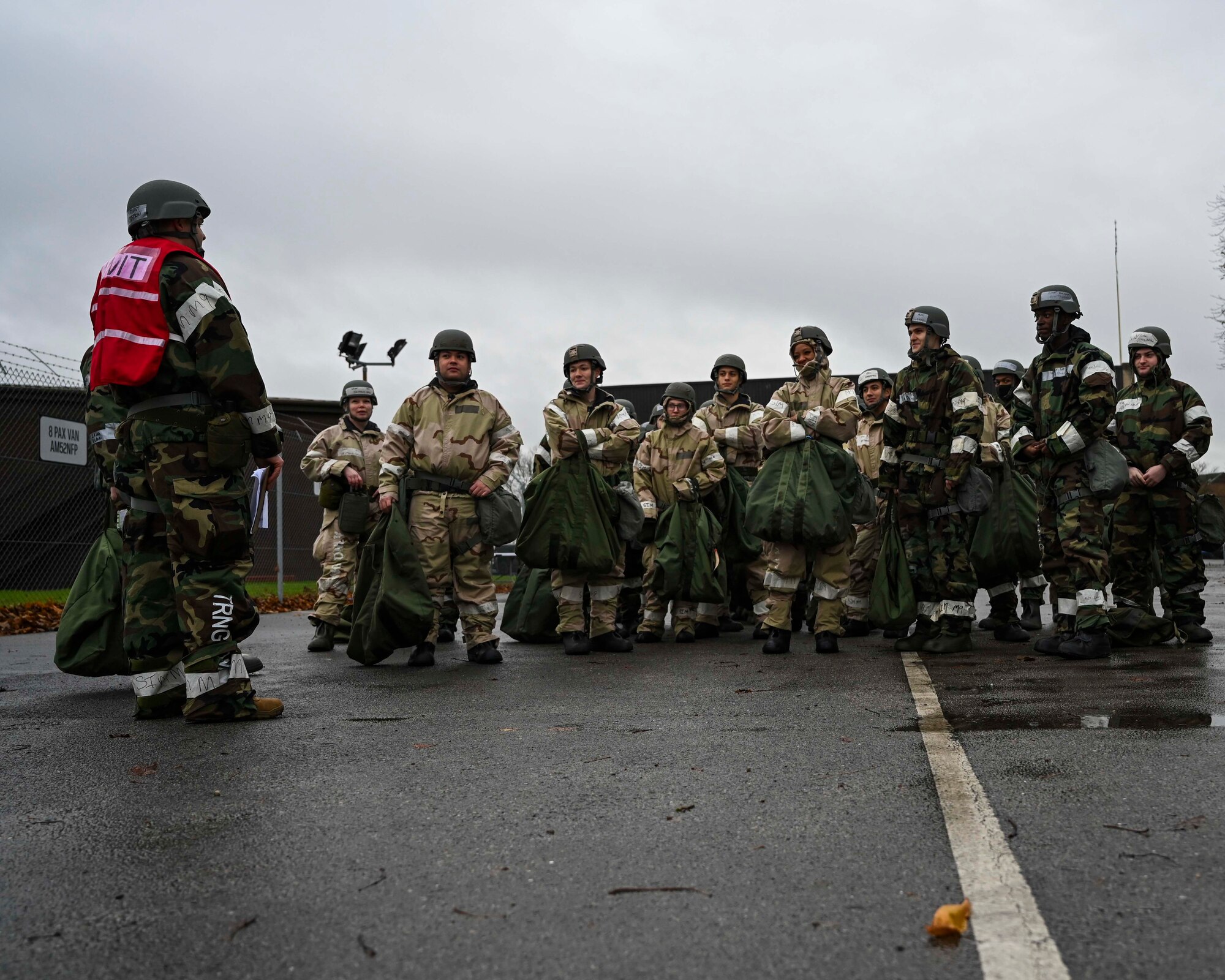 U.S. Airmen with the 100th Logistics Readiness Squadron provide feedback at the conclusion of Ability to Survive and Operate exercise, Royal Air Force Mildenhall, England, Dec. 3, 2021. The ATSO rodeo provided Airmen with basic survival and operational skills that allow the mission to continue in a contested environment. (U.S. Air Force photo by Airman 1st Class Viviam Chiu).