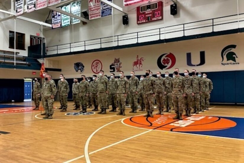Soldiers from Headquarters and Headquarters Battery, 1-107th Field Artillery Regiment, 2nd Infantry Brigade Combat Team, 28th Infantry Division stand in formation during a deployment ceremony Dec. 5 in New Castle, Pa.