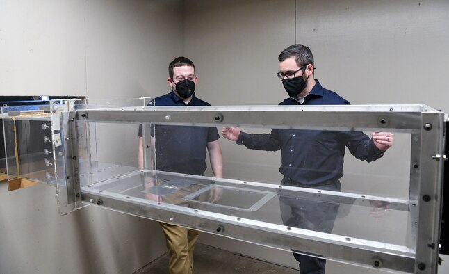 From right, Adam Moon, Air Force project manager for the Arnold Engineering Development Complex Innovation Center, and Dr. Justin Garrard, AEDC Test Operations and Sustainment contractor project manager for the center, discuss potential uses of the low-speed wind tunnel recently installed in the center at Arnold Air Force Base, Tenn., Sept. 29, 2021. The Innovation Center is being created to provide engineers a space to research and experiment. (U.S. Air Force photo by Jill Pickett)