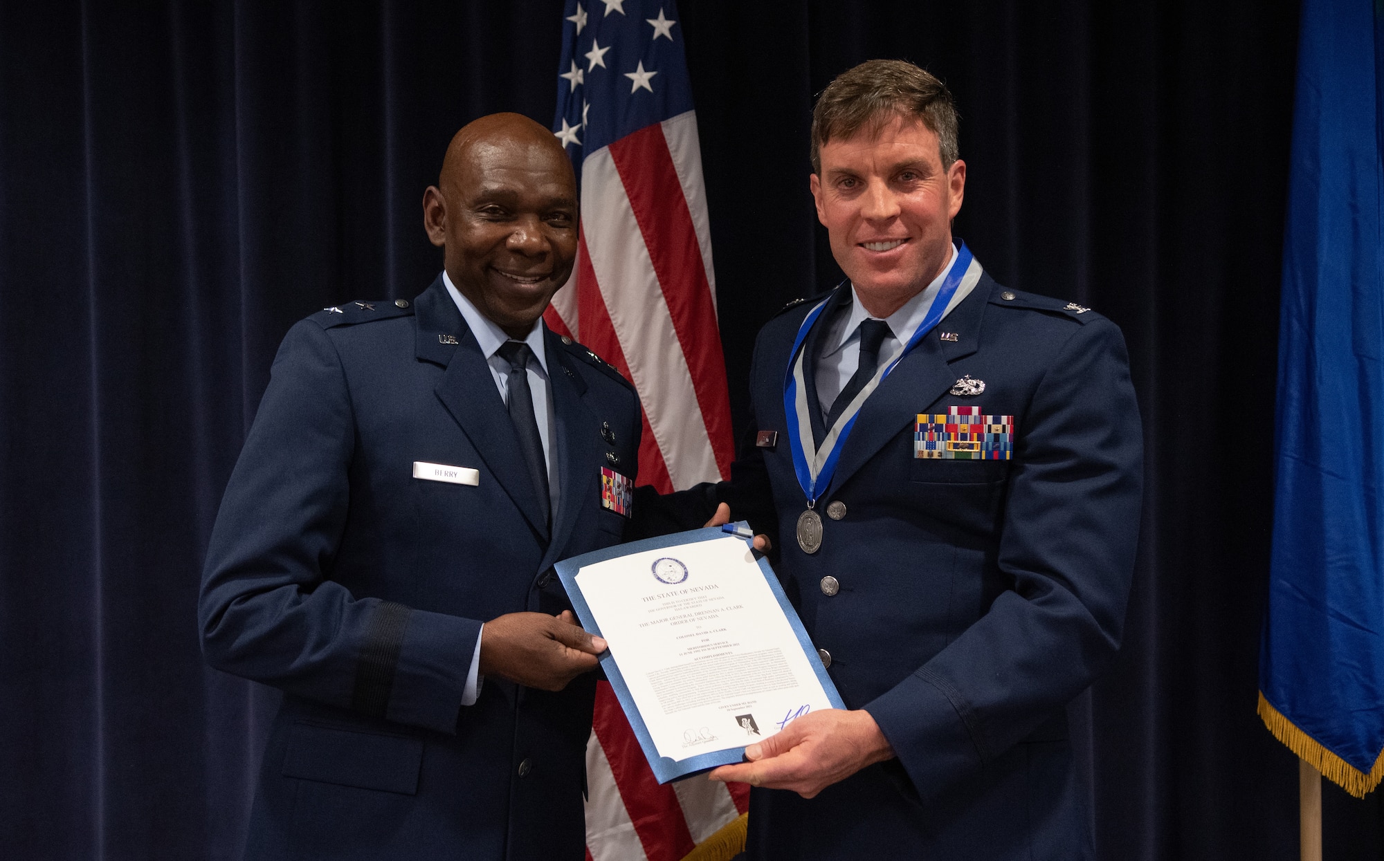 Maj. Gen. Ondra Berry (left), Nevada’s Adjutant General, presents Col. David Clark (right), special projects officer with the Nevada National Guard State Headquarters, with the certificate for the Maj. Gen. Drennan A. Clark Order of Nevada Award.