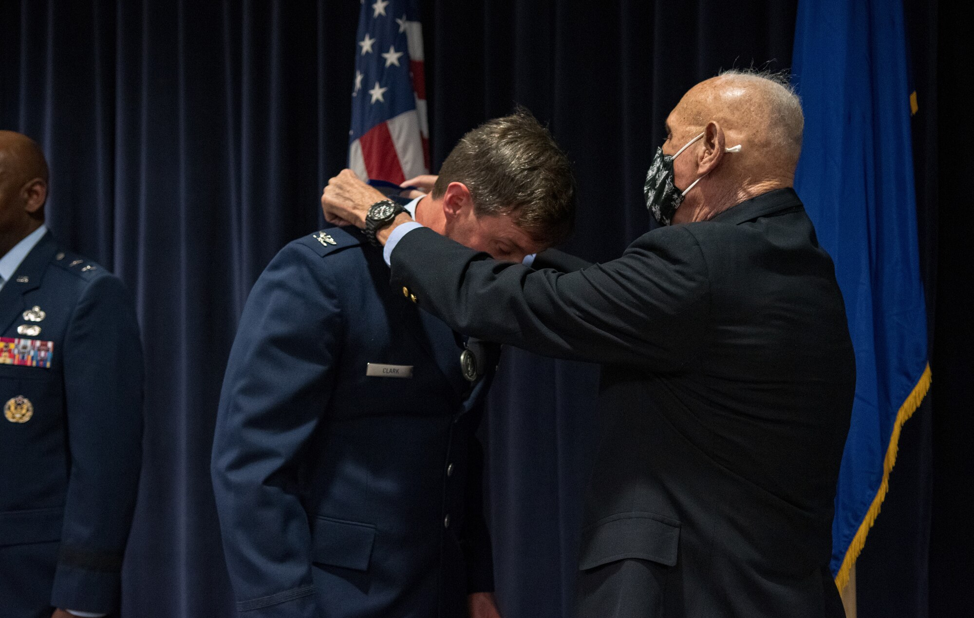Col. David Clark (left), special projects officer with the Nevada National Guard State Headquarters, is presented the Maj. Gen. Drennan A. Clark Order of Nevada Medal by his father, Maj. Gen. (ret.) Drennan Clark (right) during a ceremony at the Nevada Air National Guard Base.