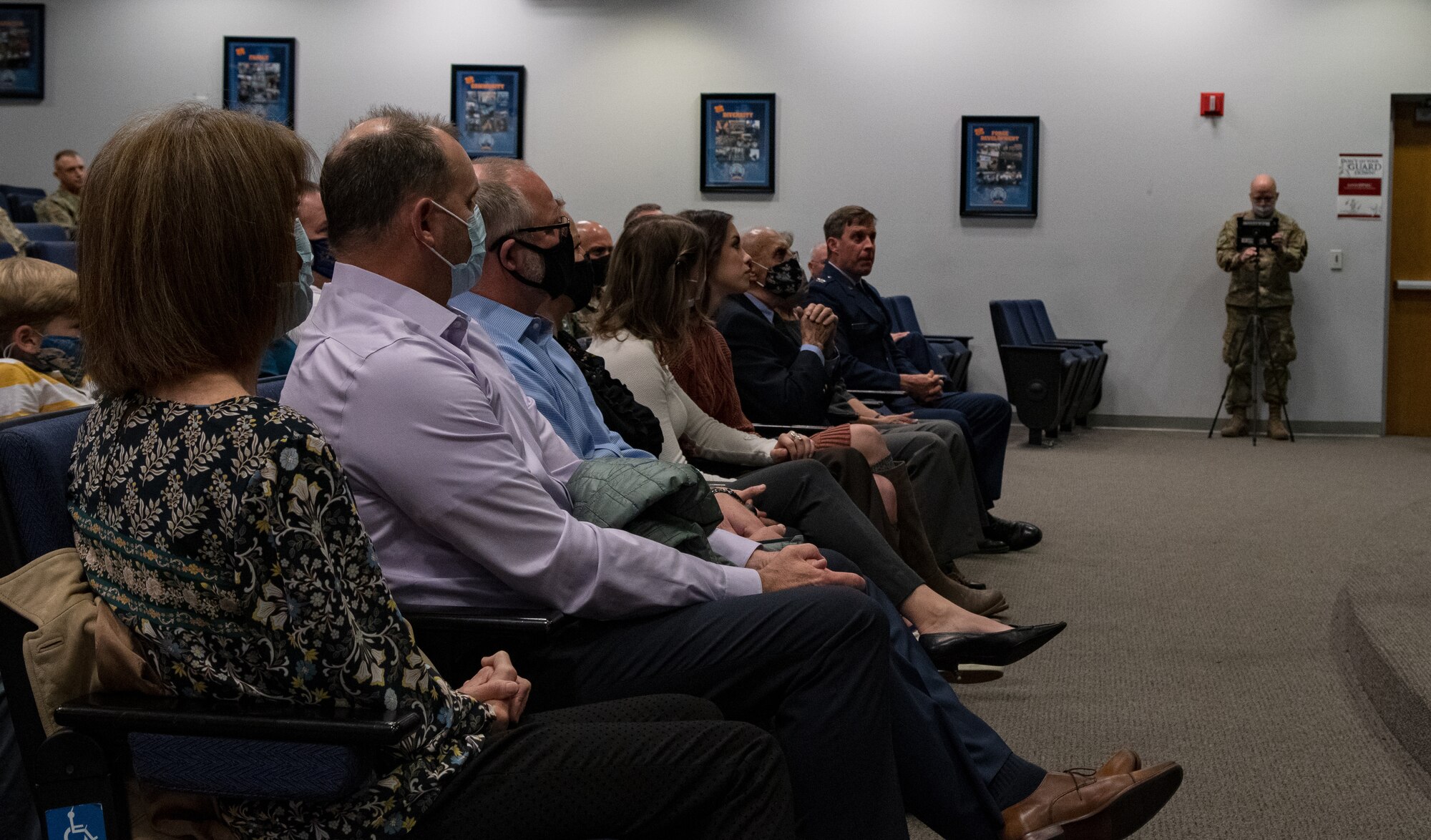 Col. David Clark’s family sits as they listen to Maj. Gen. Ondra Berry, Nevada’s Adjutant General, discuss Clarks achievements thus far in his career.