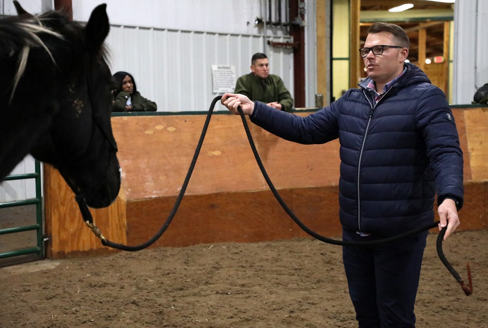 Maj. Jacob Lee, 198th Military Police Battalion executive officer, leads a therapy horse around during the Executive Leaders Performance Course at the Kentucky Horse Park’s Creech Therapeutic Riding Center in Lexington, Ky., Dec. 1, 2021.