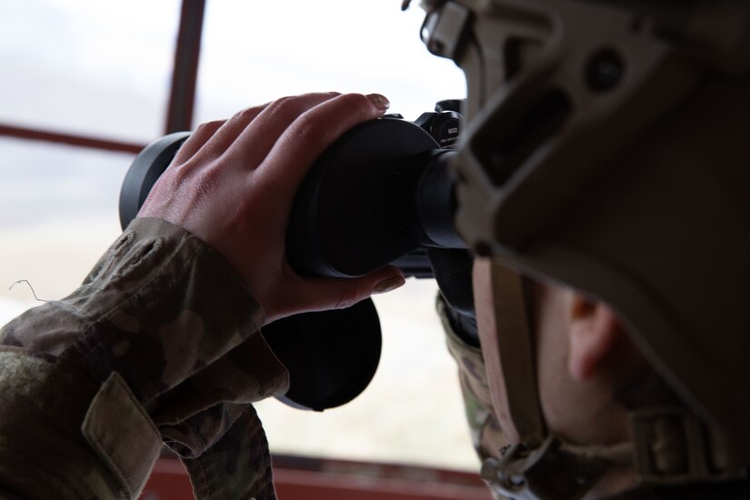 U.S. Army National Guard, Staff Sgt. Andrea Chica, a competitor representing the 2nd Battalion, 211th General Support Aviation Battalion, prepares to call for fire during the Utah National Guard Best Warrior Competition at Camp Williams, Utah, Nov. 8. 2021