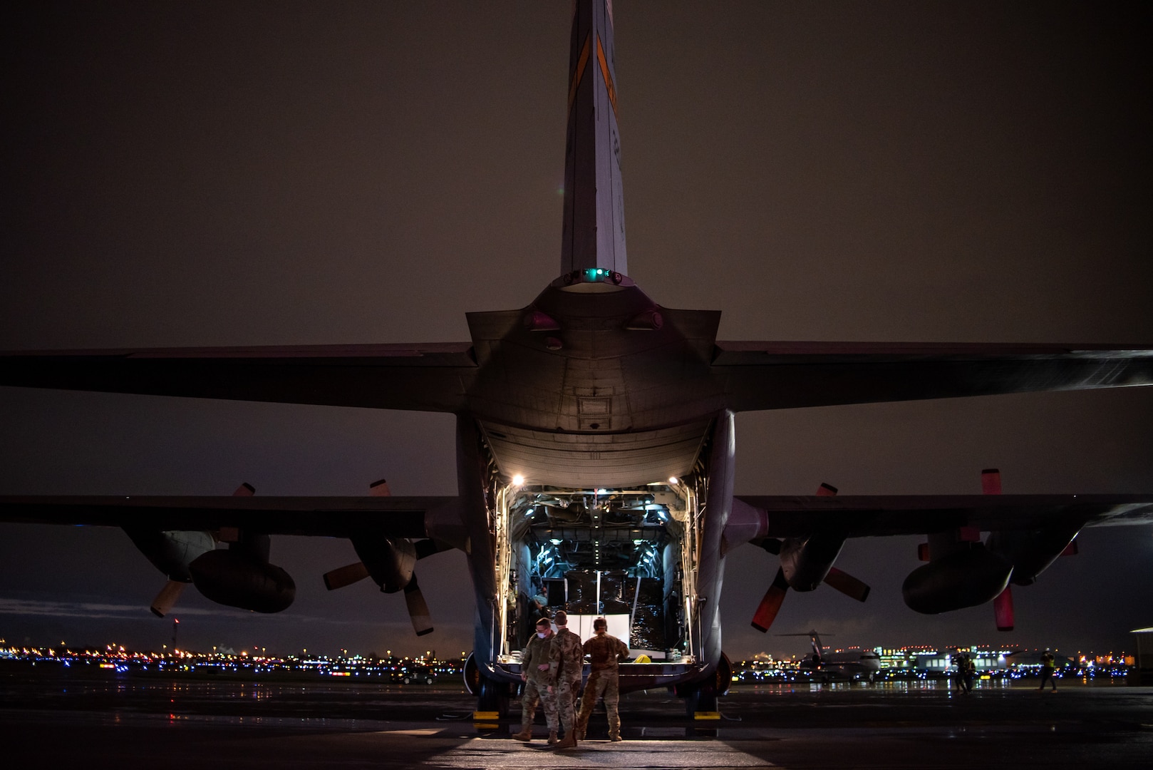 A C-130H Hercules aircraft assigned to the 182nd Airlift Wing, Illinois Air National Guard, delivers 250 medical isolation pods to Chicago Midway International Airport, Chicago, Ill., April 8, 2020. Two 182nd Airlift Wing C-130 aircraft and aircrews flew the pods cross-country and overnight in a homeland defense mission for use at the McCormick Place COVID-19 alternate care facility. (U.S. Air Force Photo by Senior Airman Jay Grabiec)