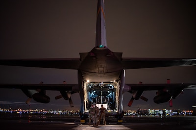 A C-130H Hercules aircraft assigned to the 182nd Airlift Wing, Illinois Air National Guard, delivers 250 medical isolation pods to Chicago Midway International Airport, Chicago, Ill., April 8, 2020. Two 182nd Airlift Wing C-130 aircraft and aircrews flew the pods cross-country and overnight in a homeland defense mission for use at the McCormick Place COVID-19 alternate care facility. (U.S. Air Force Photo by Senior Airman Jay Grabiec)