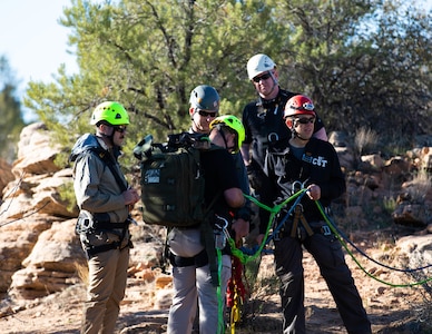 Staff Sgt. Brian Conger, a medic assigned to the Utah National Guard’s 85th Weapons of Mass Destruction–Civil Support Team, performs one last safety check of his rope rig before descending a cliff face Leeds, Utah, Nov. 17, 2021.