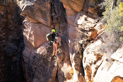 Staff Sgt. Brian Conger, a medic assigned to the Utah National Guard’s 85th Weapons of Mass Destruction–Civil Support Team, recovers a medical dummy from the bottom of a slot canyon in Leeds, Utah, Nov. 17, 2021