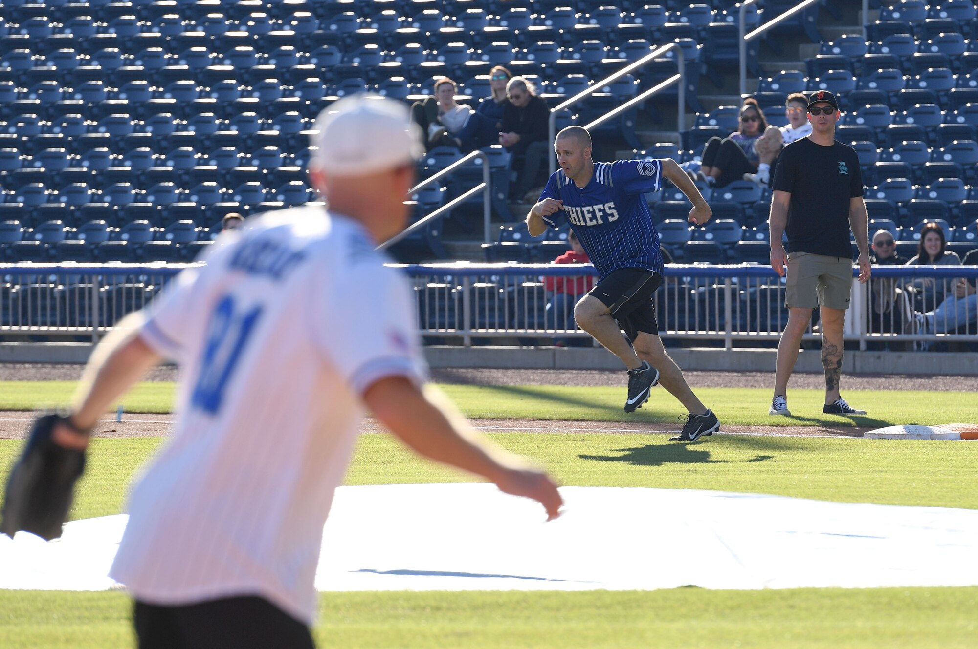 U.S. Air Force Chief Master Sgt. Lance Power, 81st Mission Support Group superintendent, runs towards first base during the Chiefs vs. Eagles softball game at MGM Park in Biloxi, Mississippi, December 3, 2021. The chief master sergeants and colonels softball match, titled Chiefs vs. Eagles, was preceded by a homerun derby and a military working dog demonstration. (U.S. Air Force photo by Kemberly Groue)