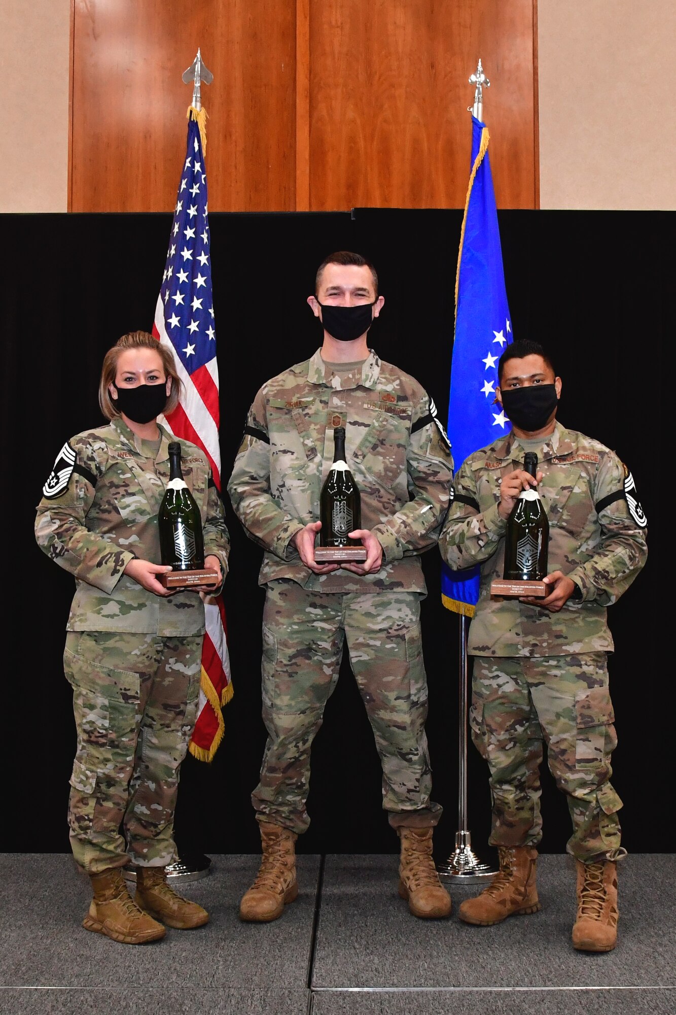 (From left) Senior Master Sgts. Kara West, 75th Logistics Readiness Squadron, Josh Ziriak, 421st Fighter Generation Squadron, and Touhid Akash, 75th Communications and Information Directorate, are welcomed to the “top of the enlisted force” during a social to recognize their selection for promotion to chief master sergeant Dec. 9, 2021, at Hill Air Force Base, Utah. Promotion to chief master sergeant is an achievement only possible for 1% of the Air Force enlisted force structure. (U.S. Air Force photo by Todd Cromar)